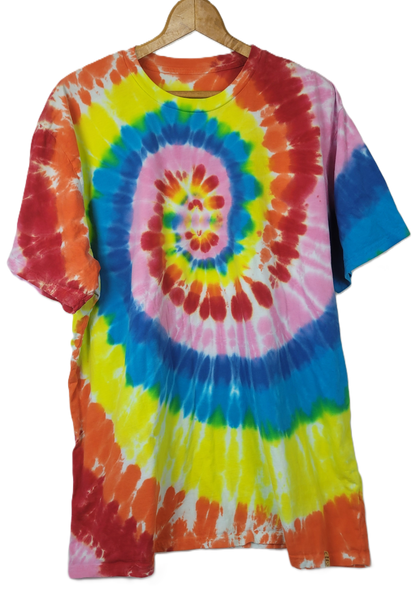 Colorful tie-dye t-shirt on a hanger with a white background