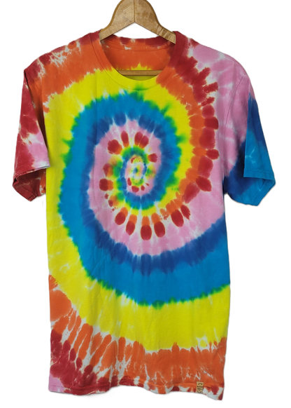 Tie-dye t-shirt with a colorful spiral pattern on a hanger against a white background