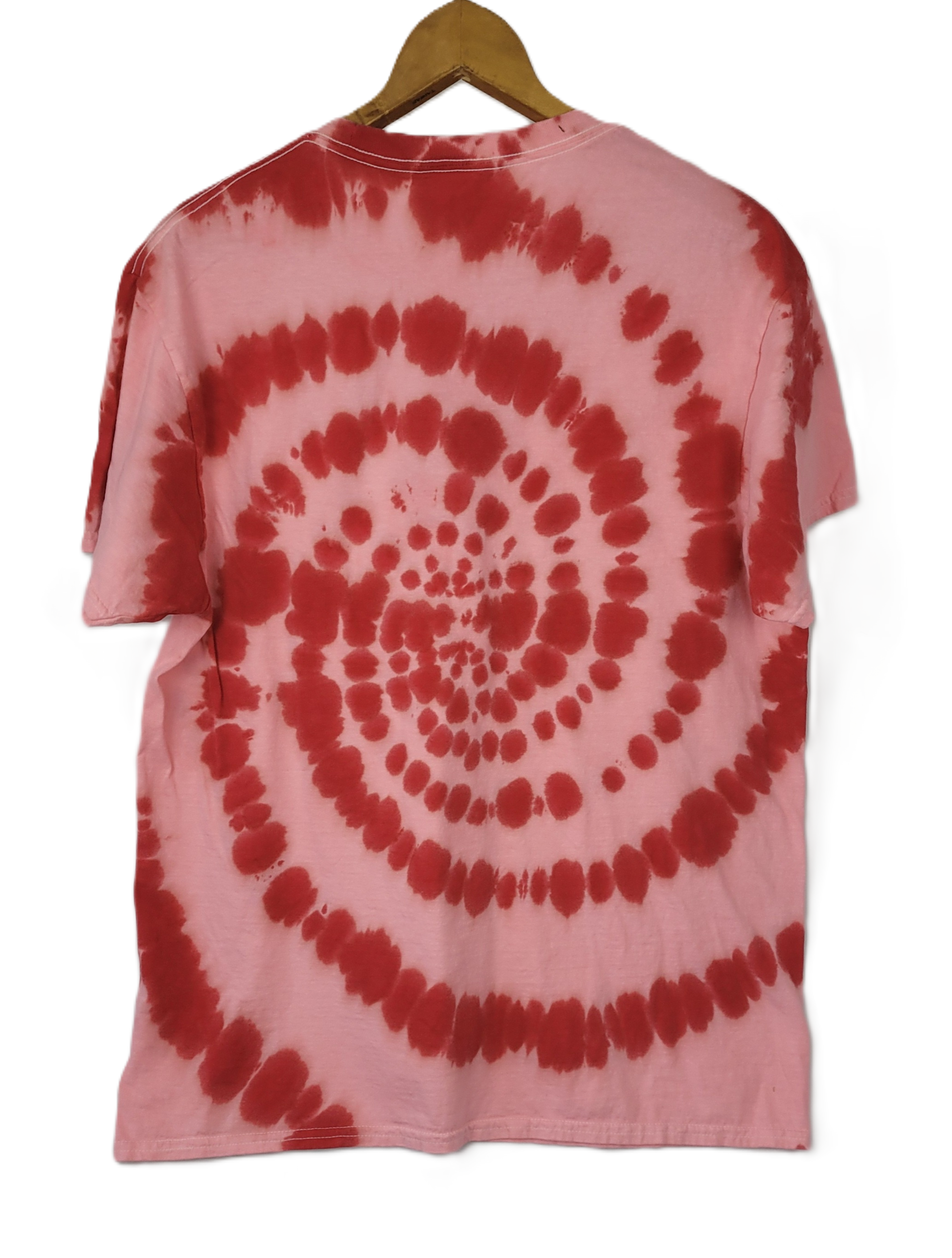 Pink and red tie-dye t-shirt on a hanger with a white background