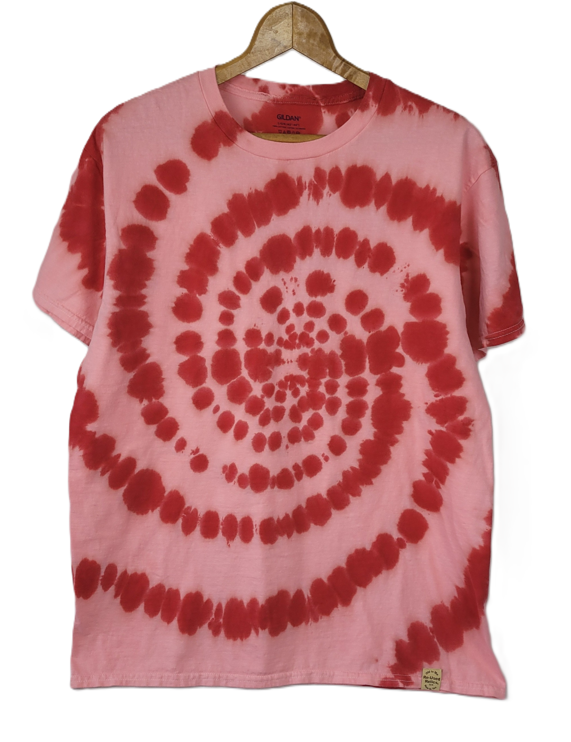 Pink and red tie-dye t-shirt on a hanger with a white background