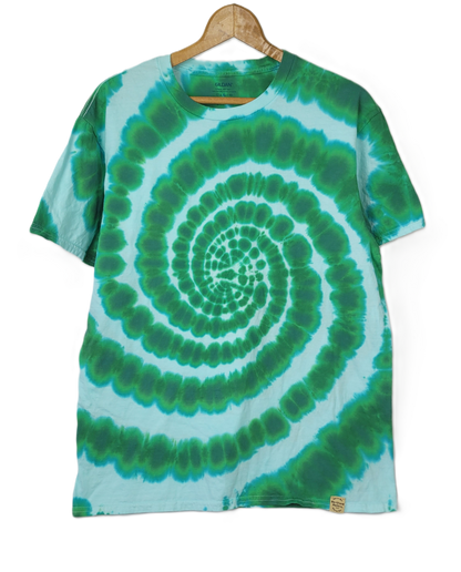 Tie-dye t-shirt with green and blue spiral pattern on a hanger