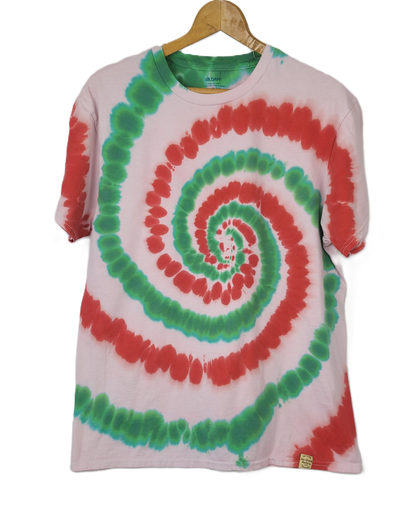 Tie-dye t-shirt with red and green spiral pattern on a hanger against a white background