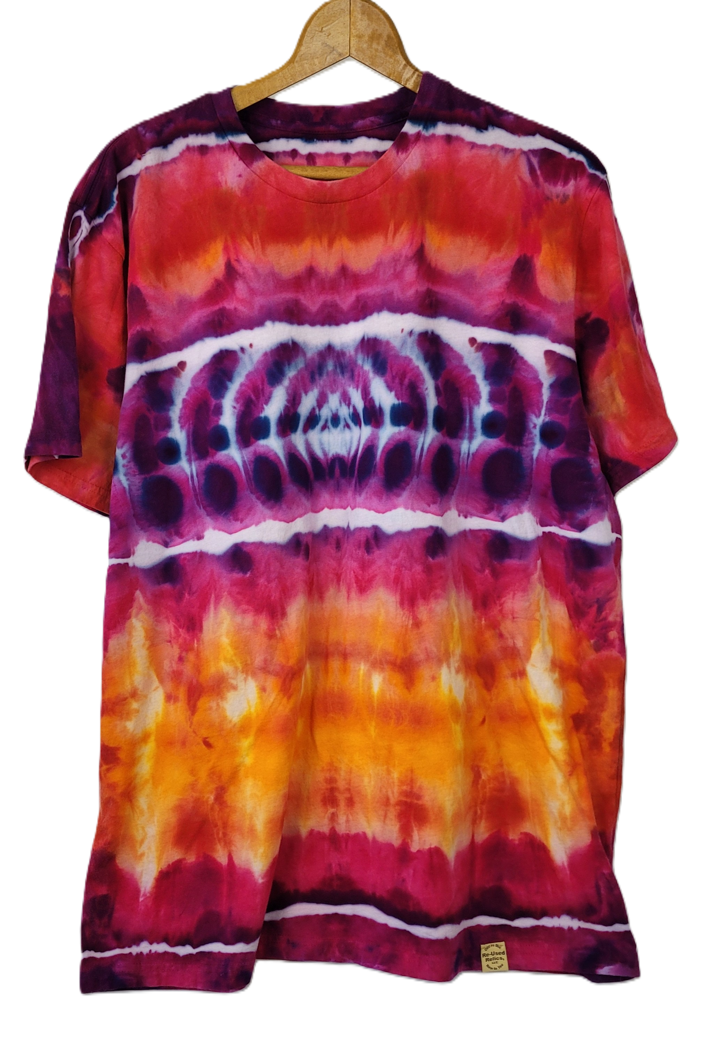 Tie-dye t-shirt with a spiral pattern on a hanger against a white background