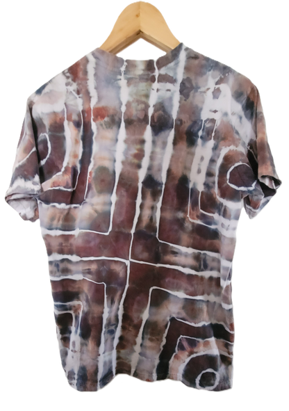 Tie-dye shirt on a wooden hanger with a white background