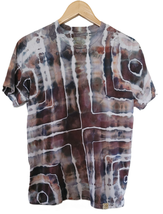 T-shirt with abstract pattern on a wooden hanger