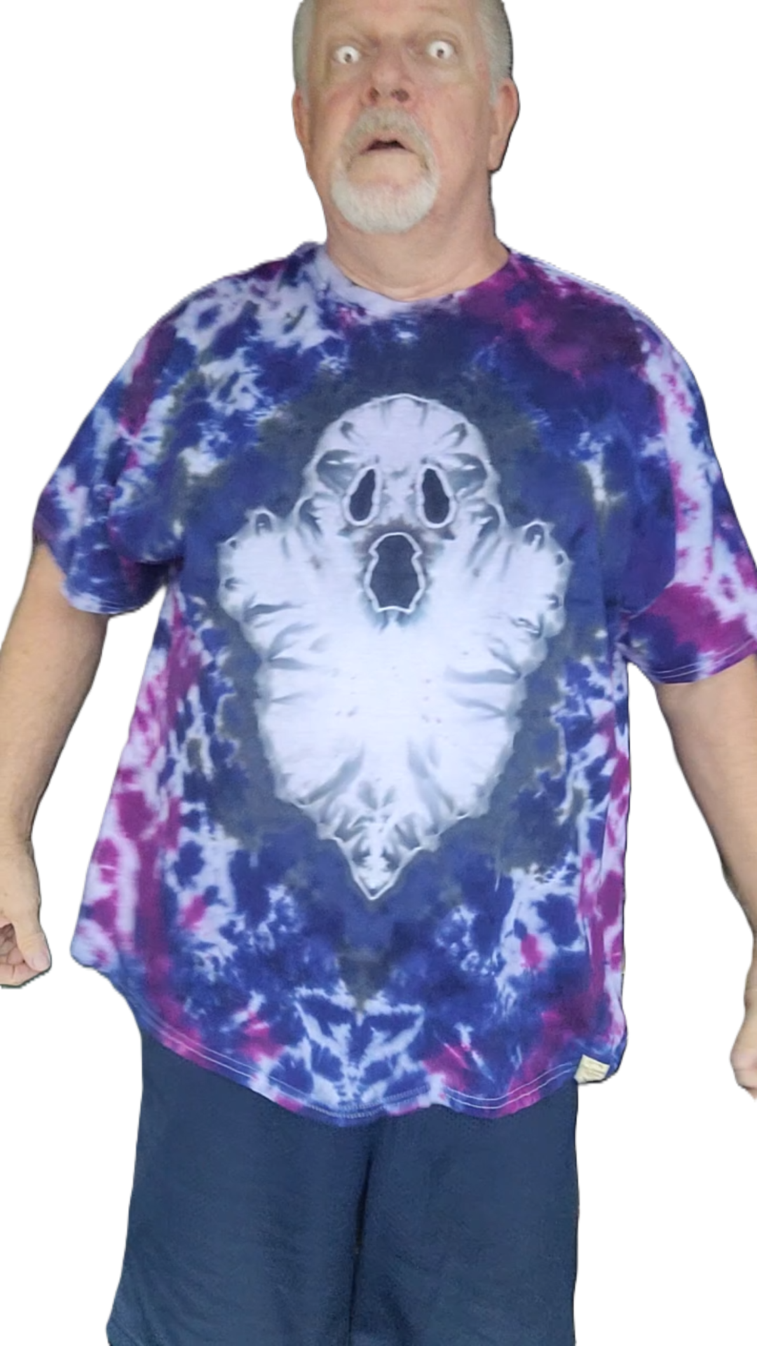 A man wearing a short-sleeve tie-dye t-shirt with a large white ghost graphic on the front, featuring blue, purple, and pink tie-dye patterns.