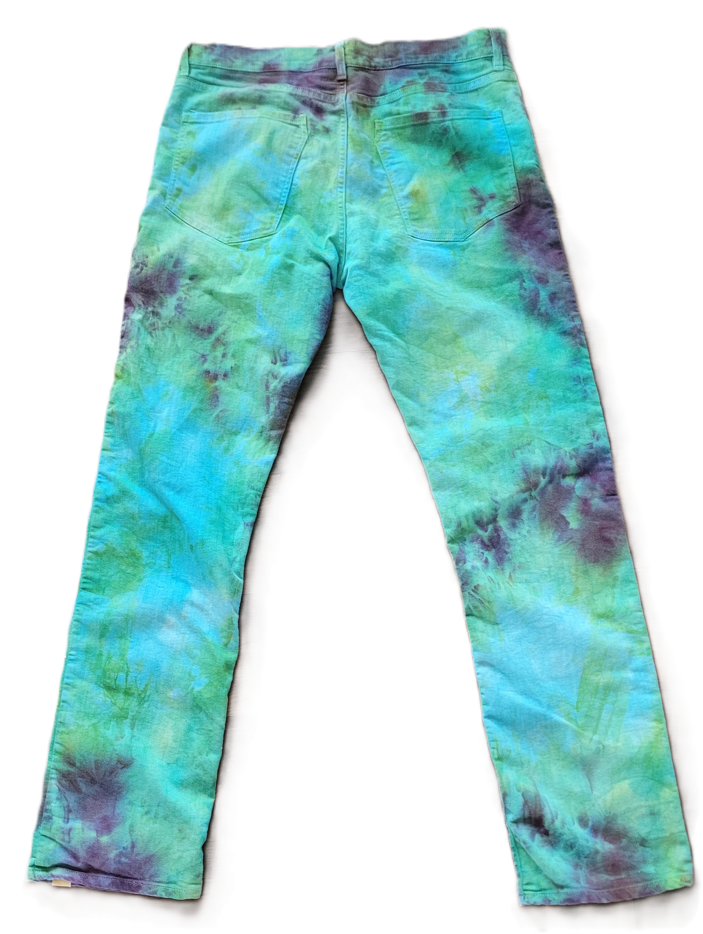 Tie-dye pants with green and blue patterns on a white background