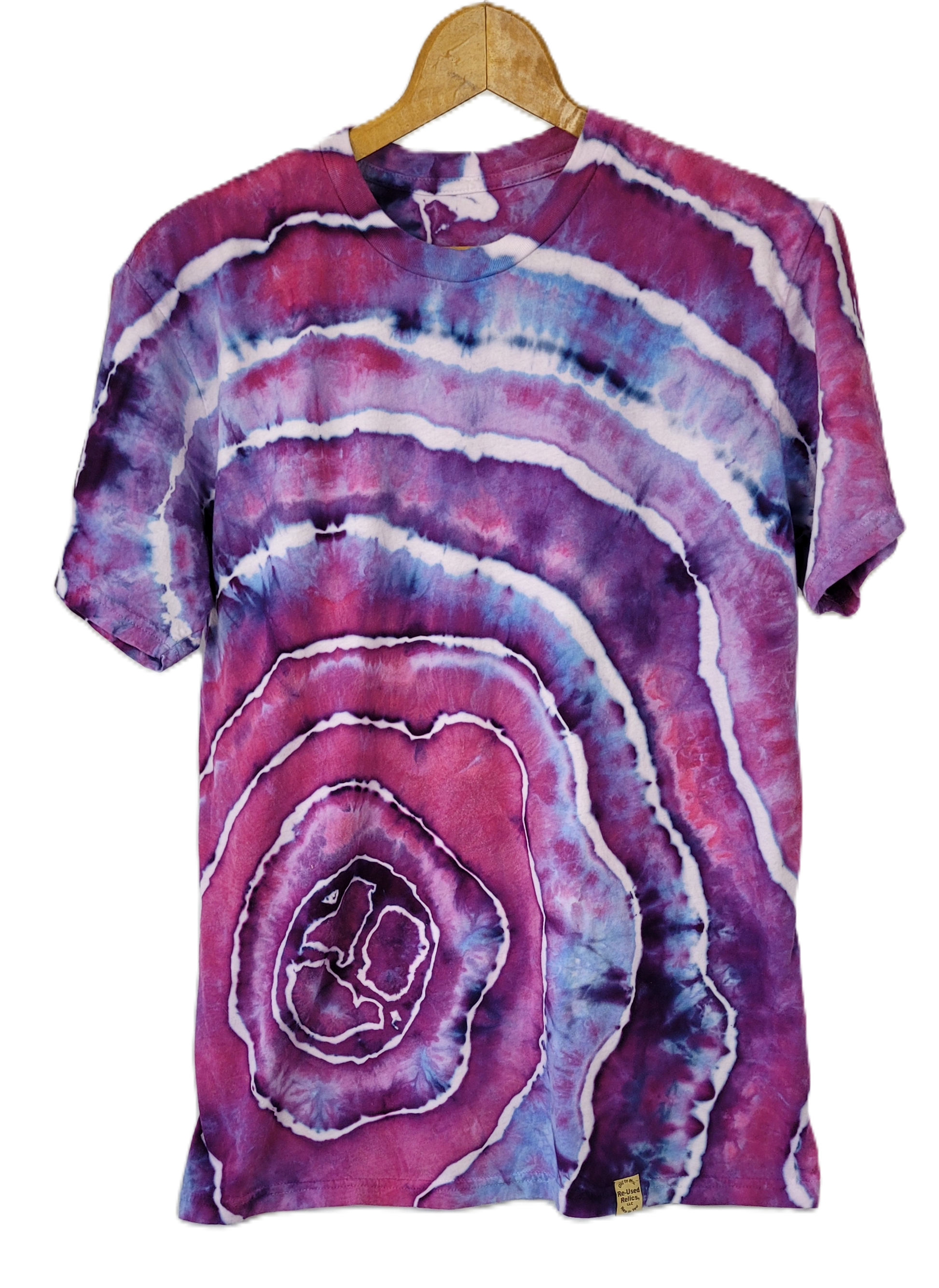 Tie-dye t-shirt with purple and pink patterns on a hanger against a white background