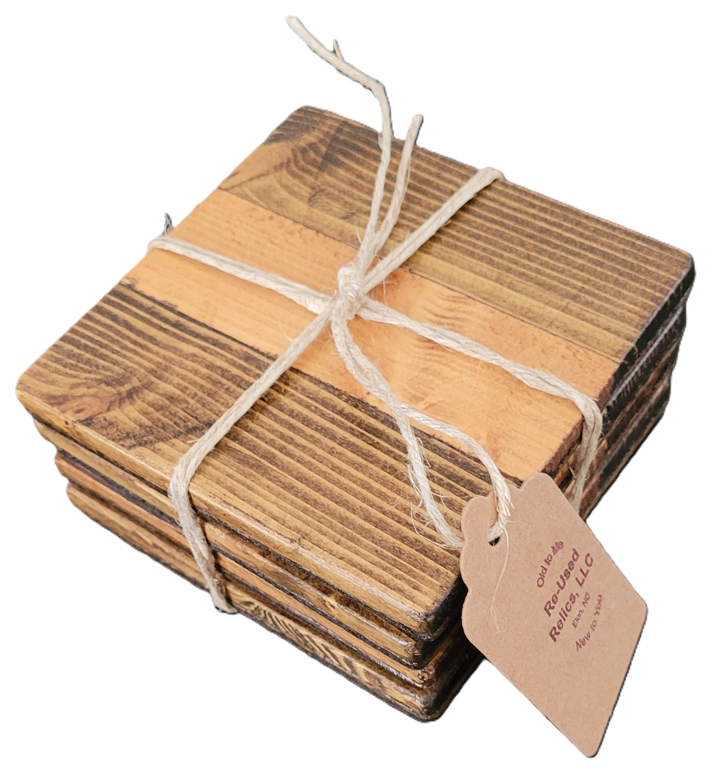 Stack of wooden coasters tied with string on a dark surface