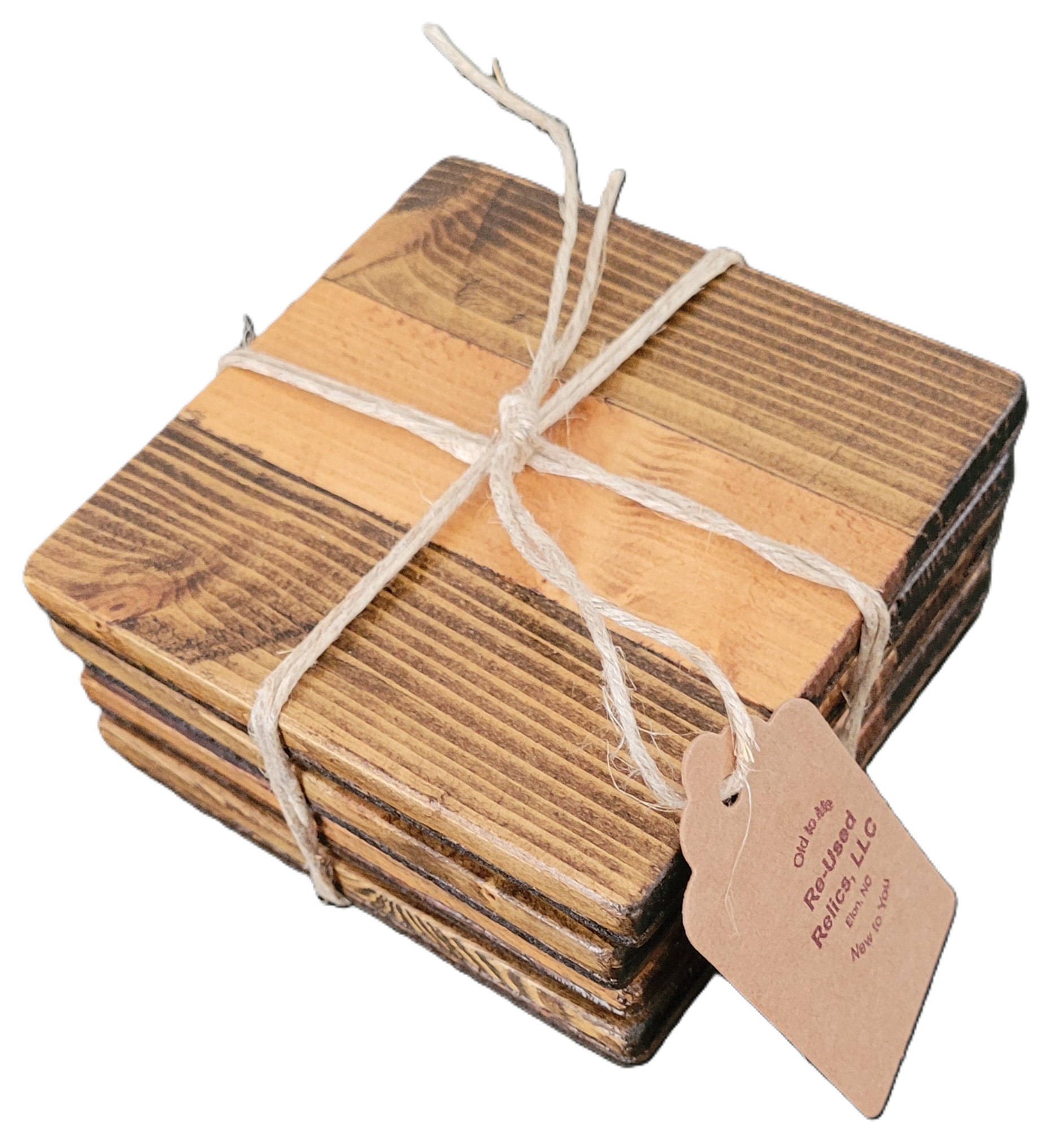Stack of wooden coasters tied with string on a dark surface
