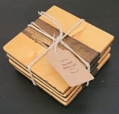 Stack of wooden coasters tied with string and a tag on a dark background