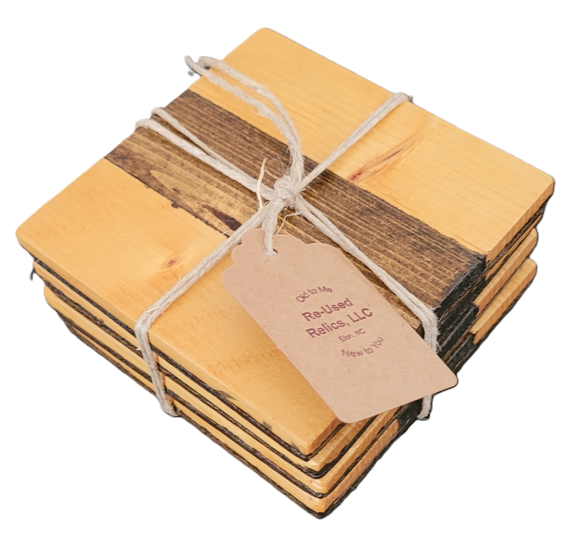 Stack of wooden coasters tied with string and a tag on a dark background