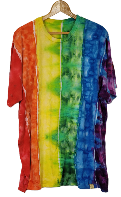 Colorful tie-dye shirt on a hanger against a white background