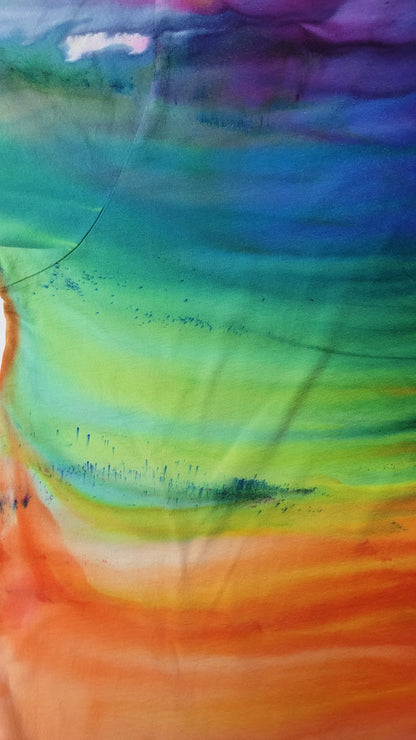 Colorful abstract tie-dye with a gradient of blue, green, yellow, orange, and purple.