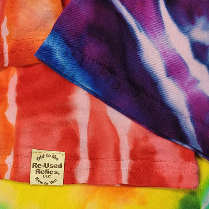 Close-up of a tie-dye fabric with a visible brand label.