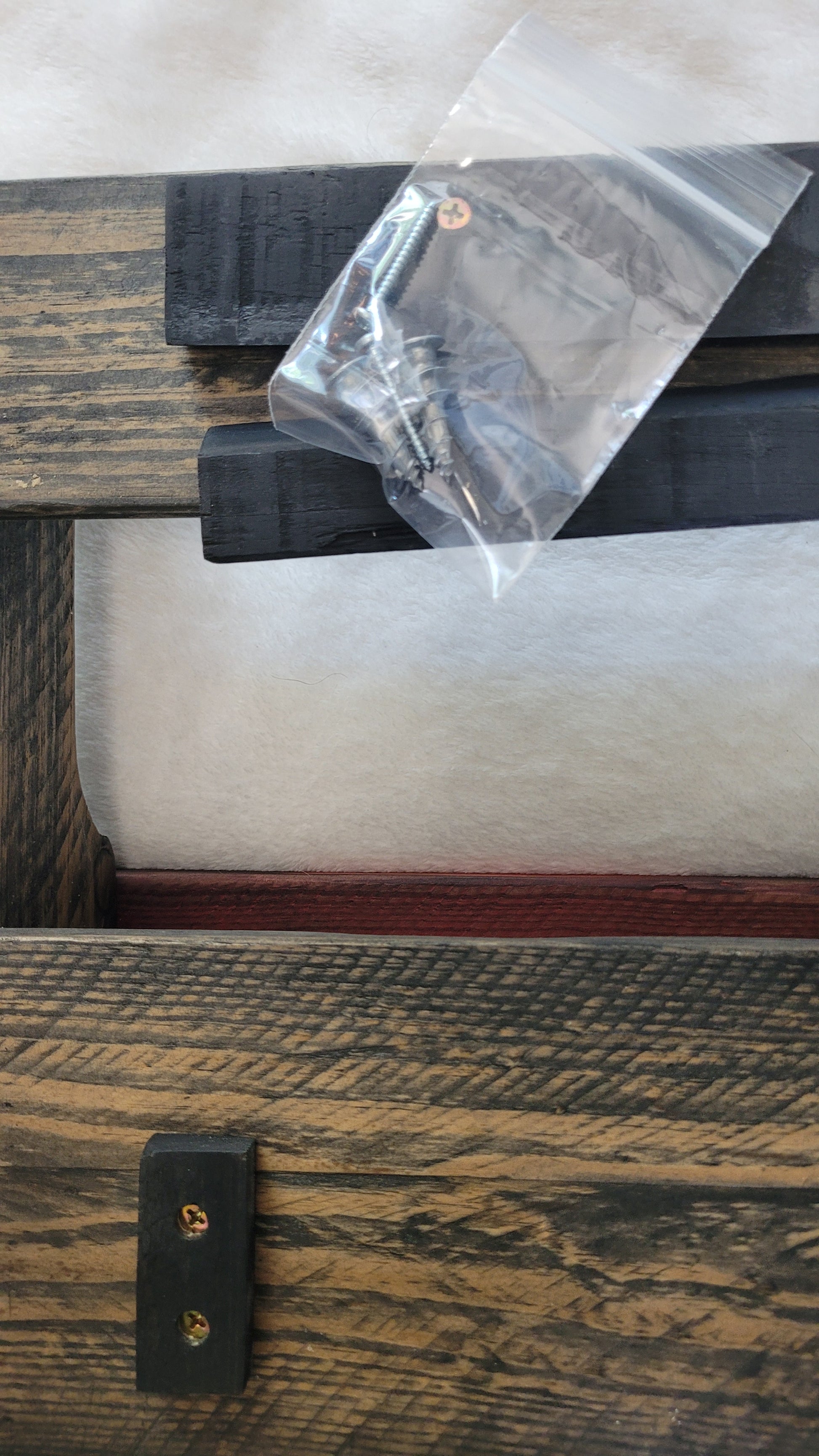 Wooden WINE RACK CLOSEUP OF BACK WITH MOUNTING BRACKET on a white surface