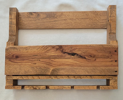 Wooden wine rack with a natural finish on a white background