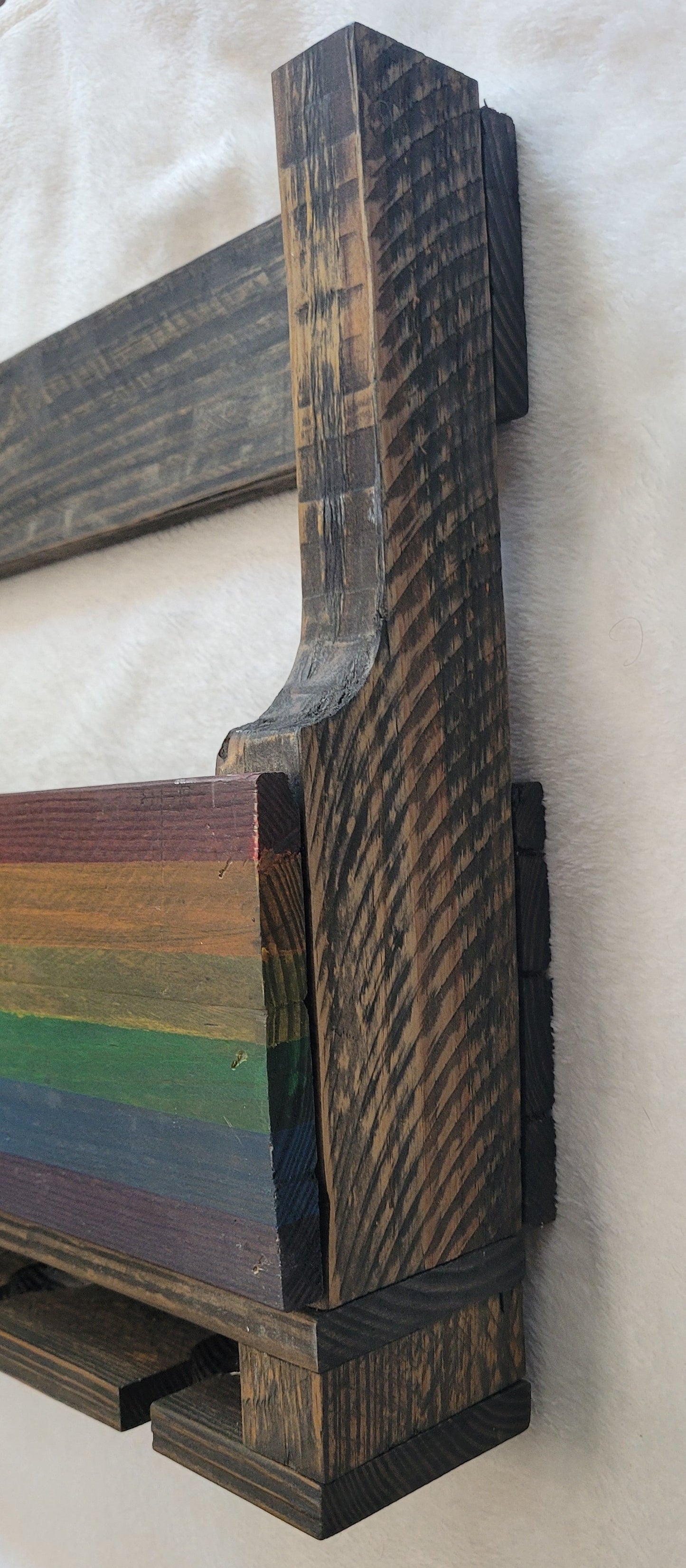 Wooden Wine Rack with rainbow design on a white background
