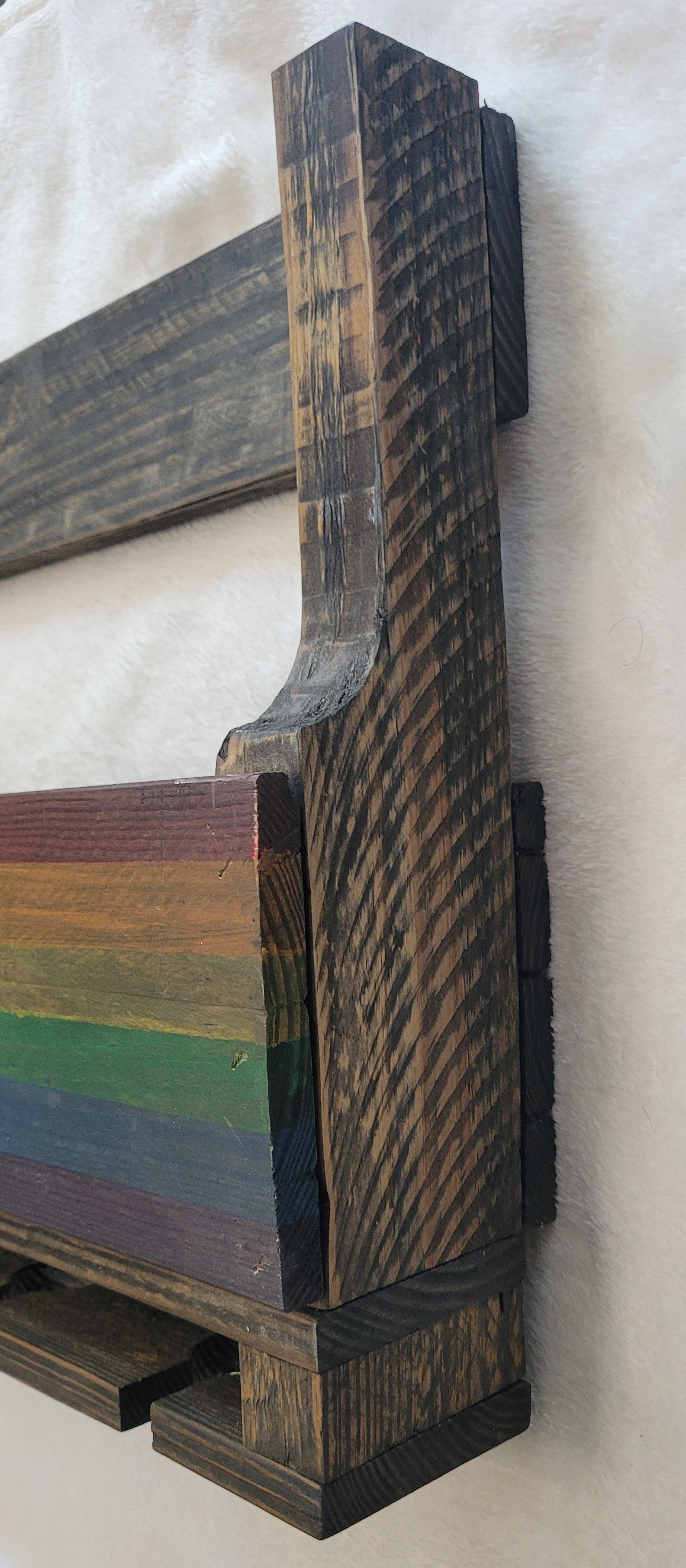 Wooden Wine Rack with rainbow design on a white background