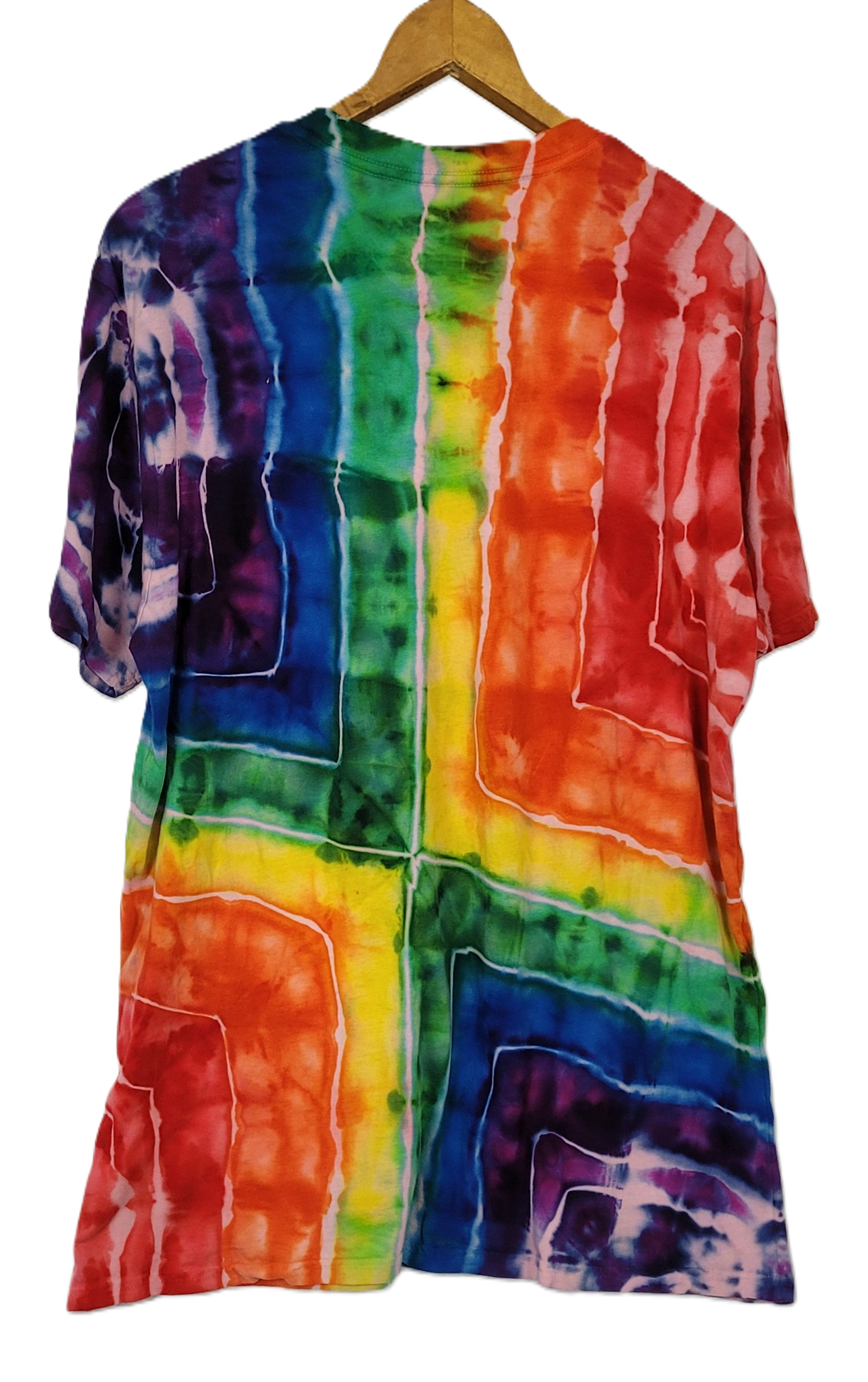 Multicolored tie-dye shirt on a hanger against a white background