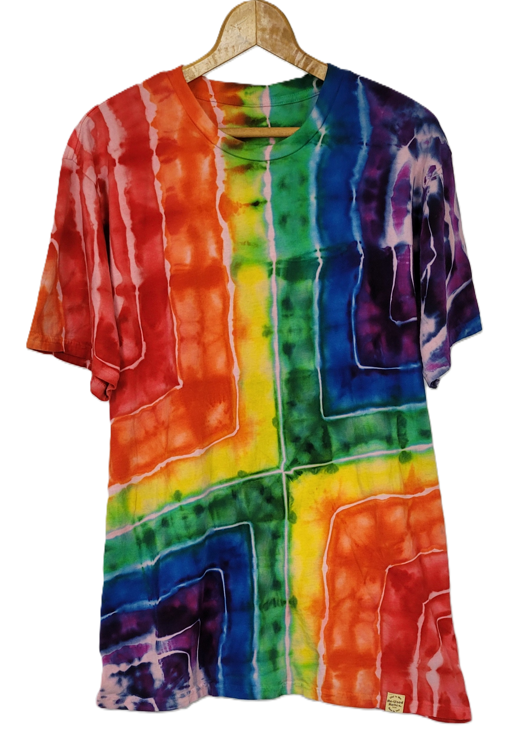 Multicolored tie-dye shirt on a hanger against a white background