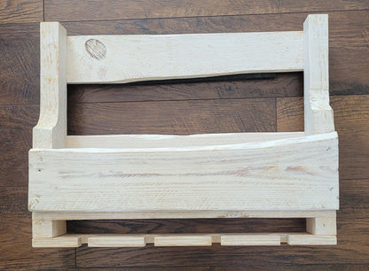 White washed wooden wine rack on a wooden floor