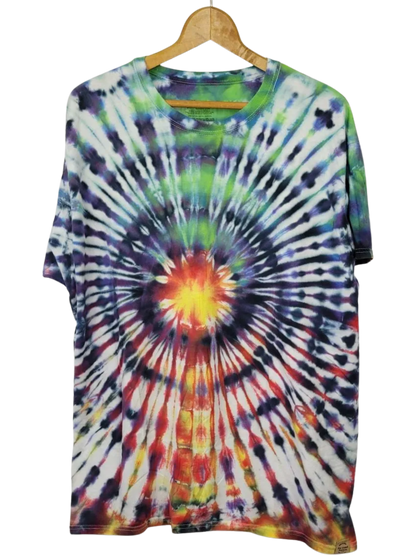 Tie-dye t-shirt on a hanger with a white background