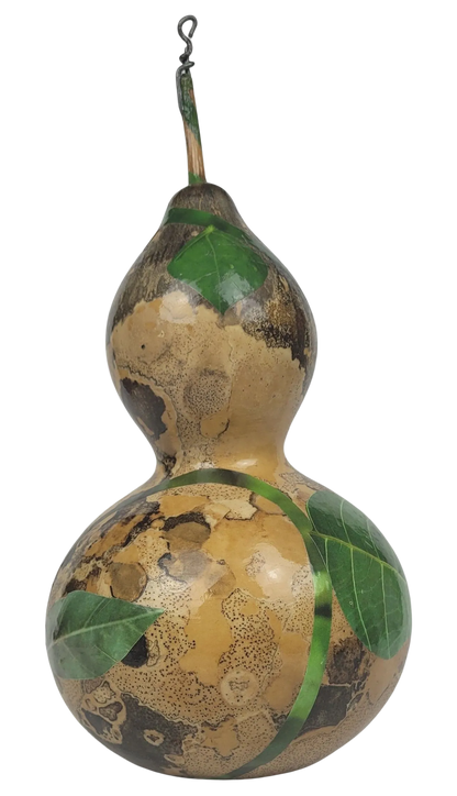 Decorative gourd with leaf patterns on a white background