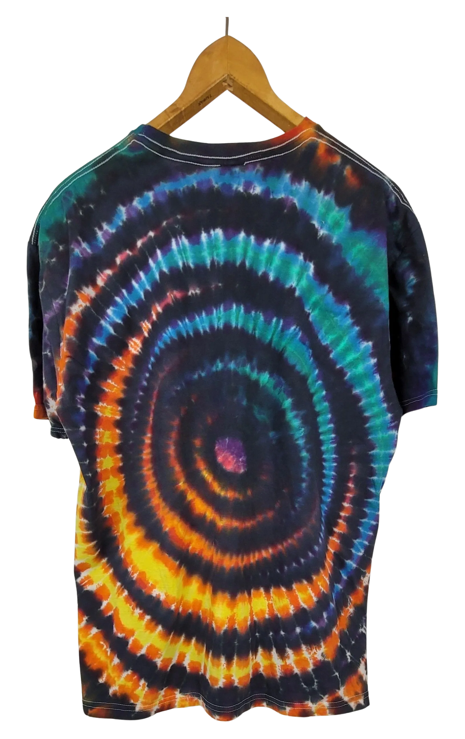 Tie-dye t-shirt with a wig wag pattern on a hanger against a white background