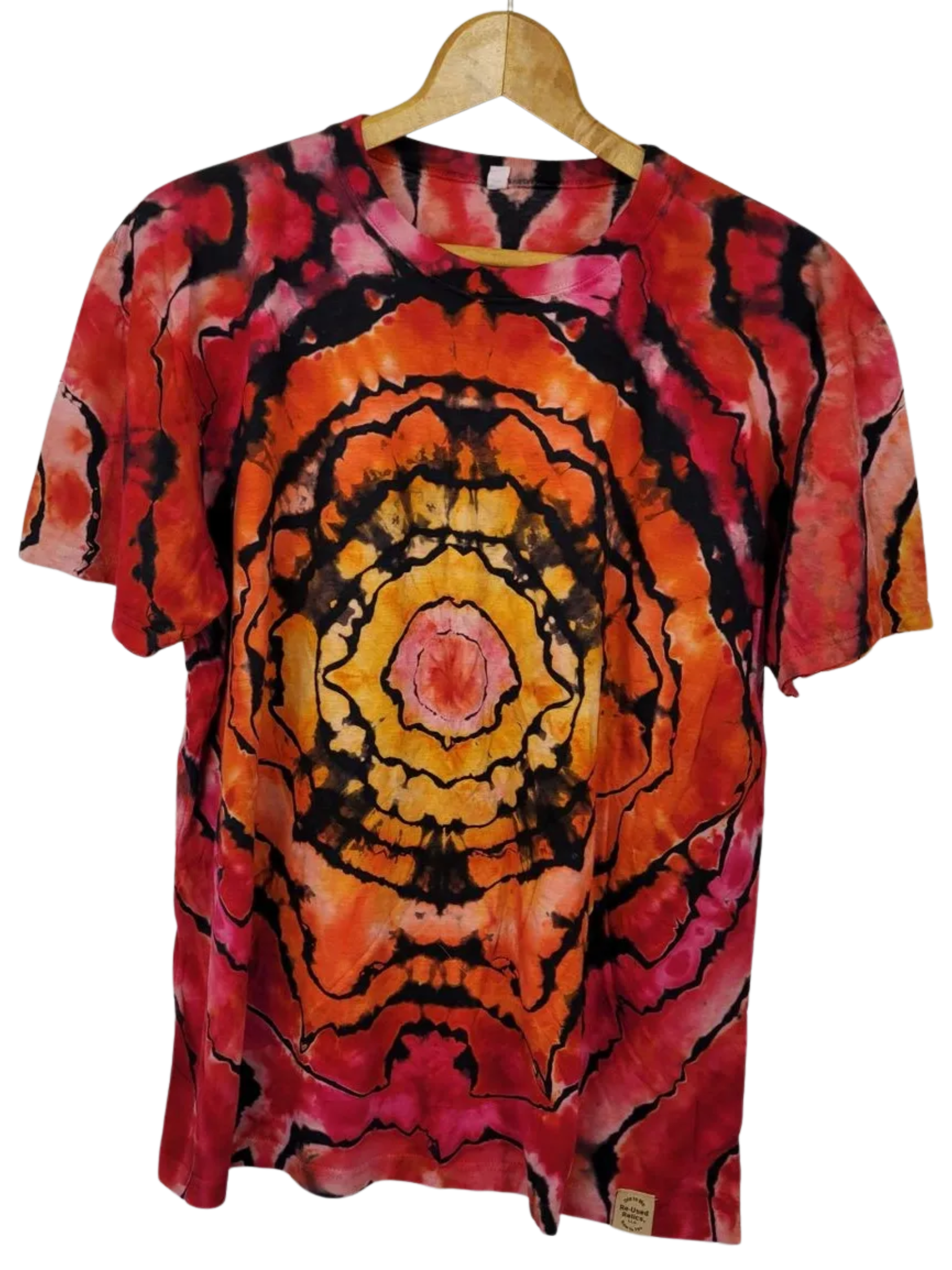 Tie-dye t-shirt with a circular pattern on a hanger against a white background