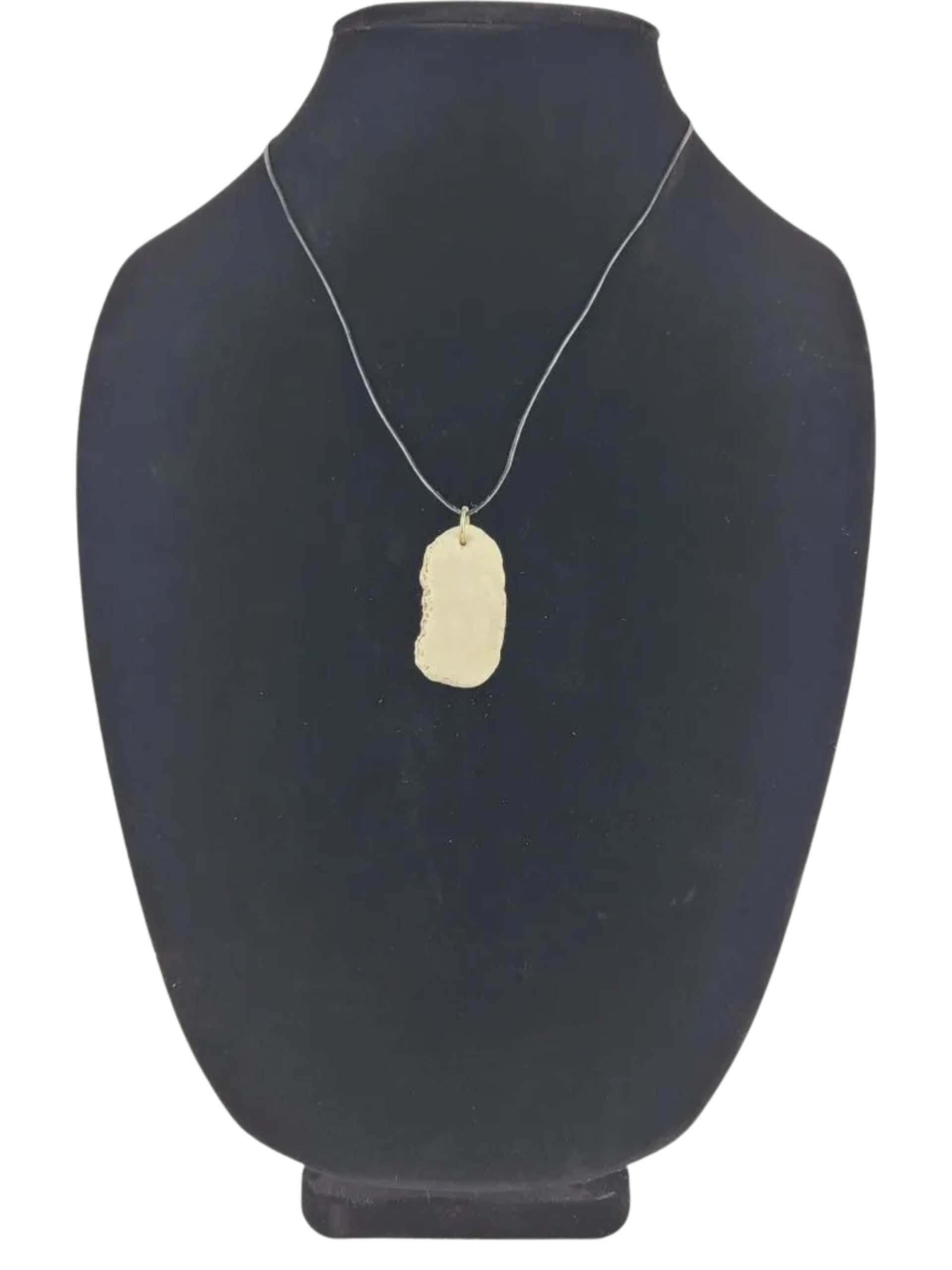 Necklace with a pendant on a black mannequin bust