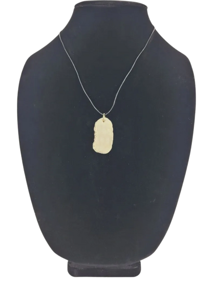 Necklace with a pendant on a black mannequin bust