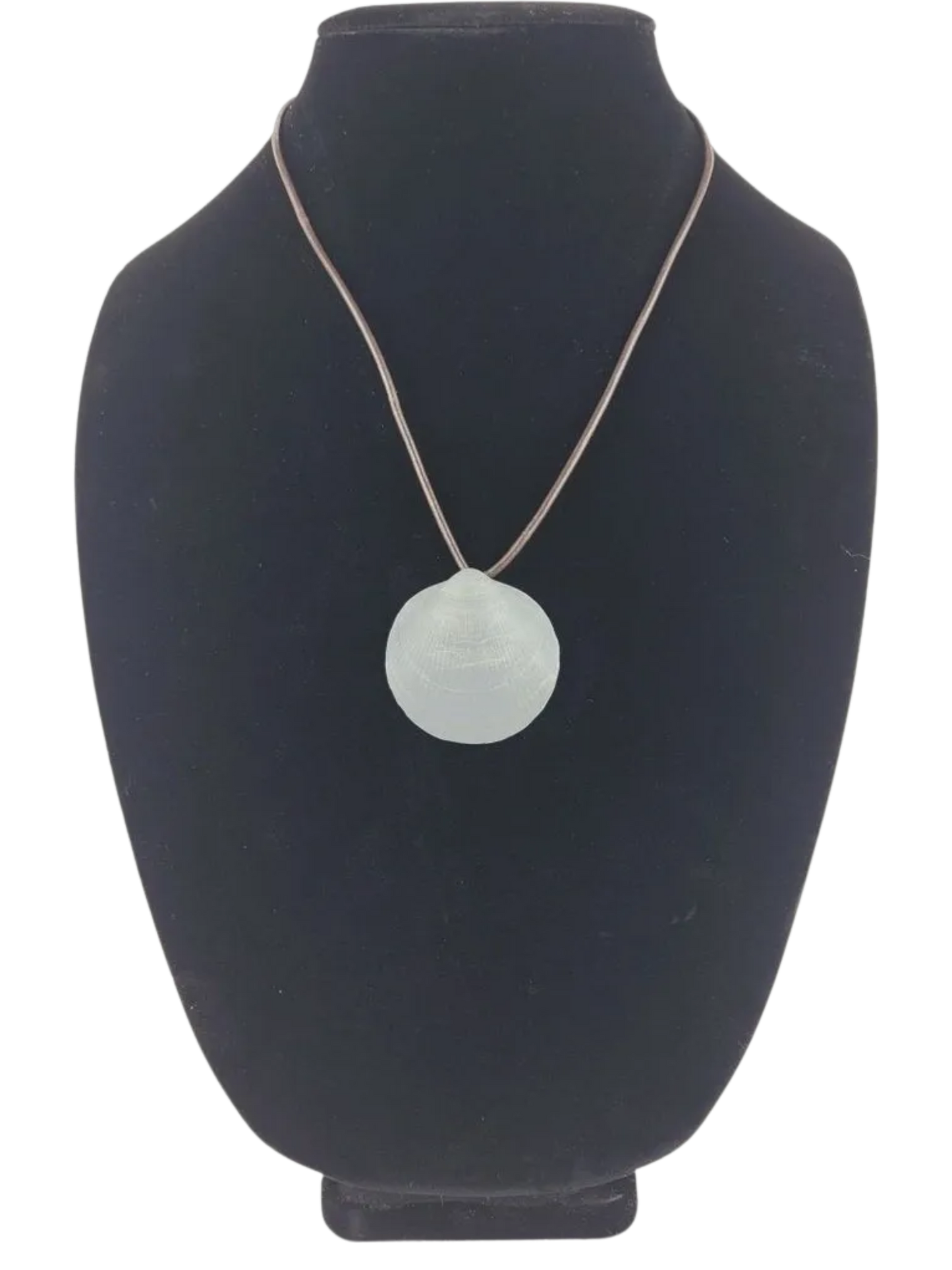 Necklace with a round pendant on a black bust