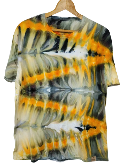 Tie-dye t-shirt with orange, black, and gray pattern on a hanger