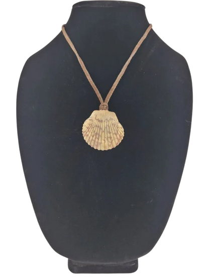 shell pendant on a black mannequin bust