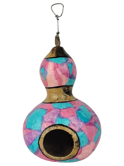 Decorative gourd birdhouse with tie-dye pattern on a white background