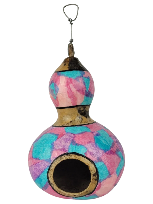 Decorative gourd birdhouse with tie-dye pattern on a white background