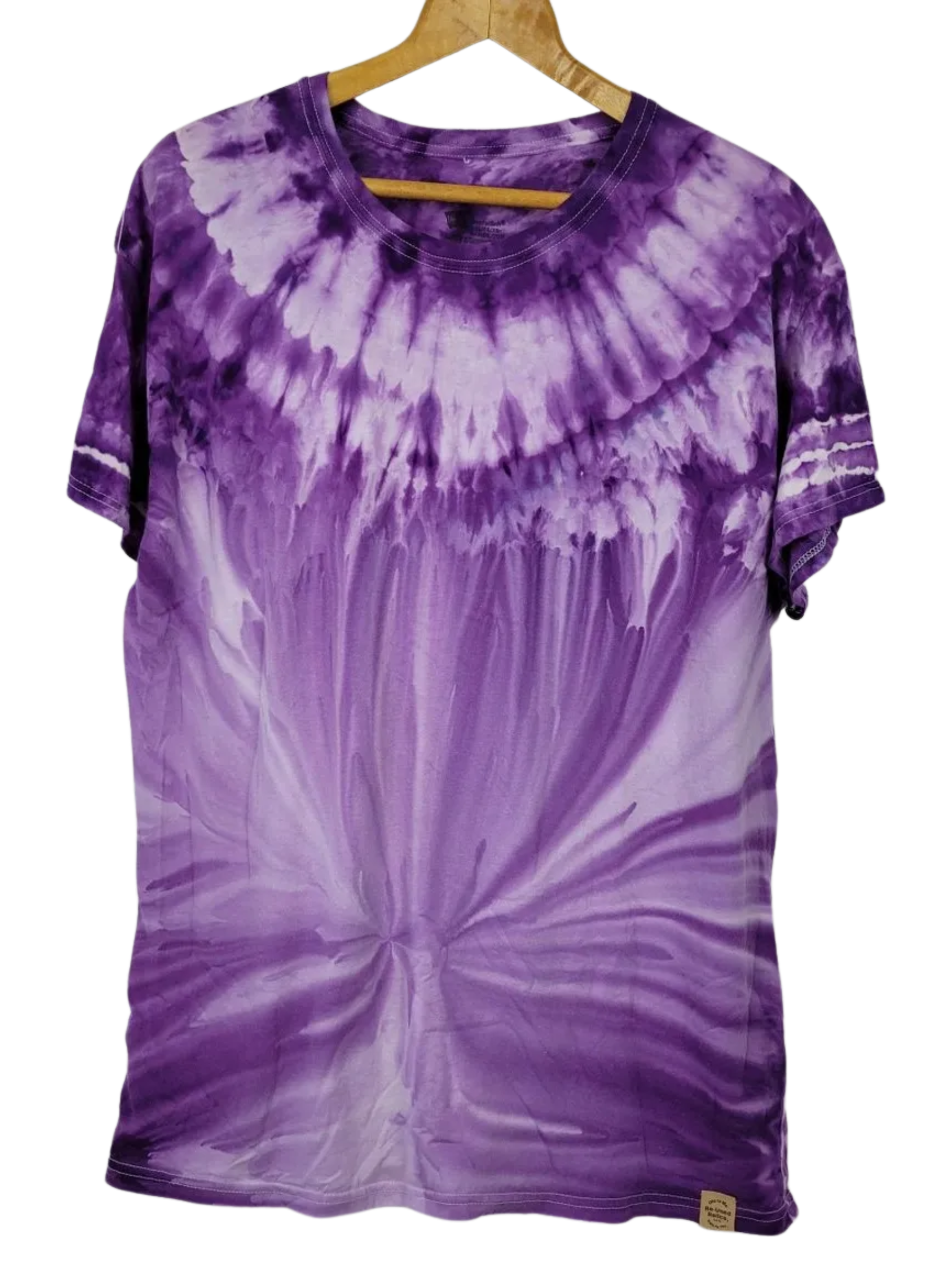 Purple tie-dye t-shirt on a hanger against a white background