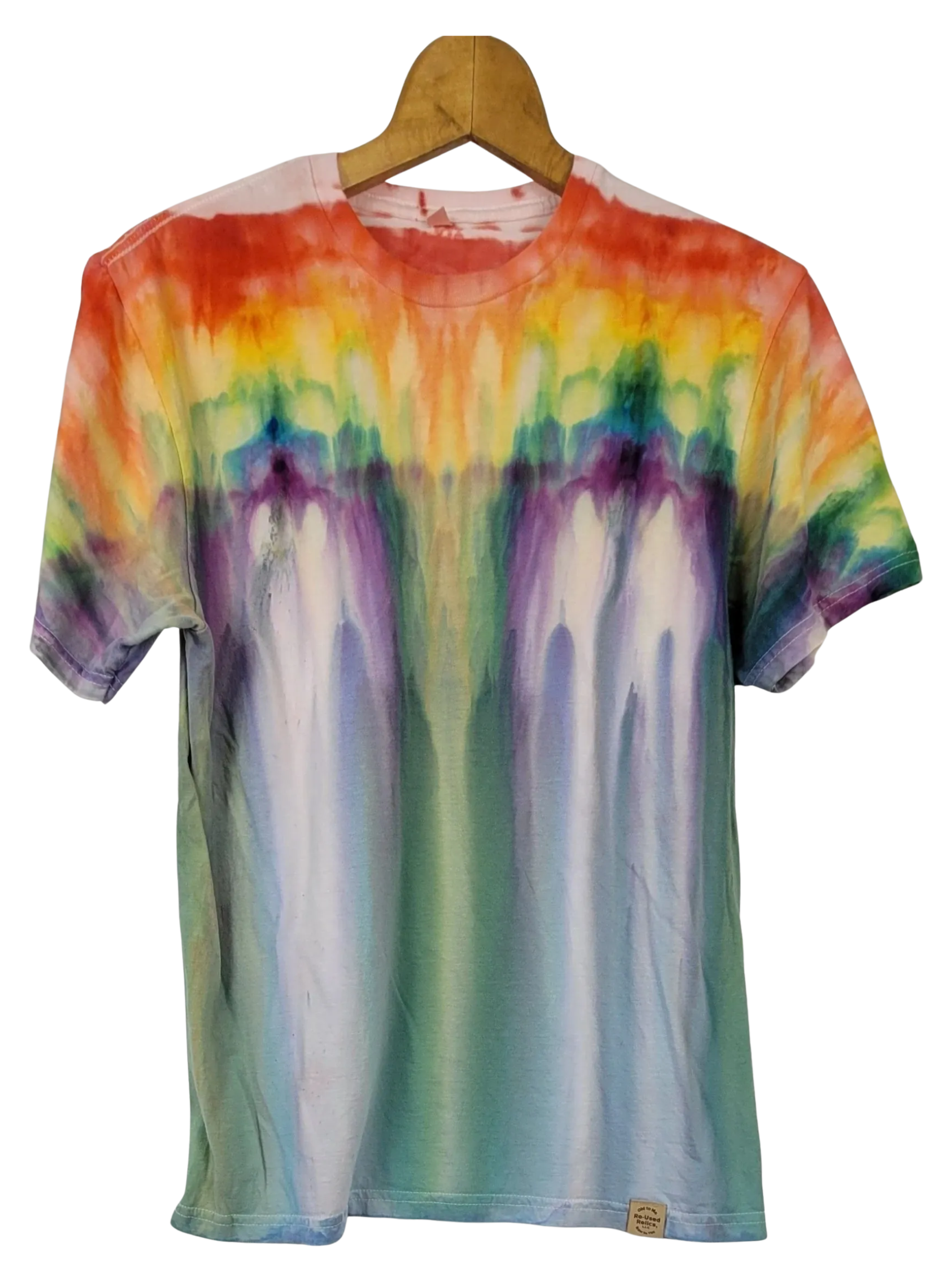 Multicolored tie-dye t-shirt on a wooden hanger against a white background