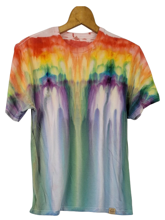Multicolored tie-dye t-shirt on a wooden hanger against a white background