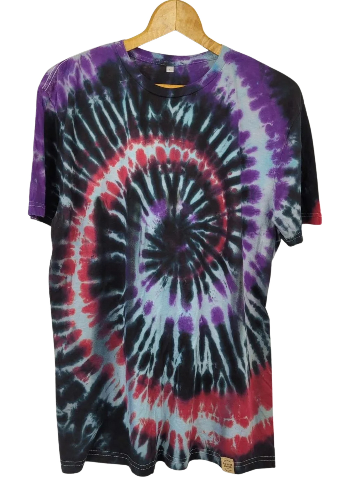 Tie-dye t-shirt with a spiral pattern on a hanger
