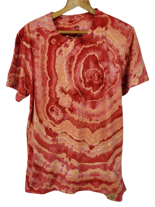 Red and orange tie-dye t-shirt on a hanger against a white background