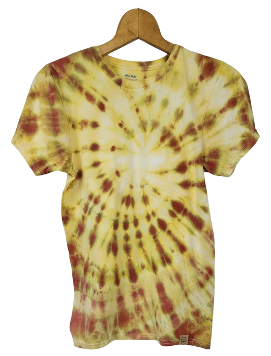 Tie-dye t-shirt with yellow and red pattern on a hanger