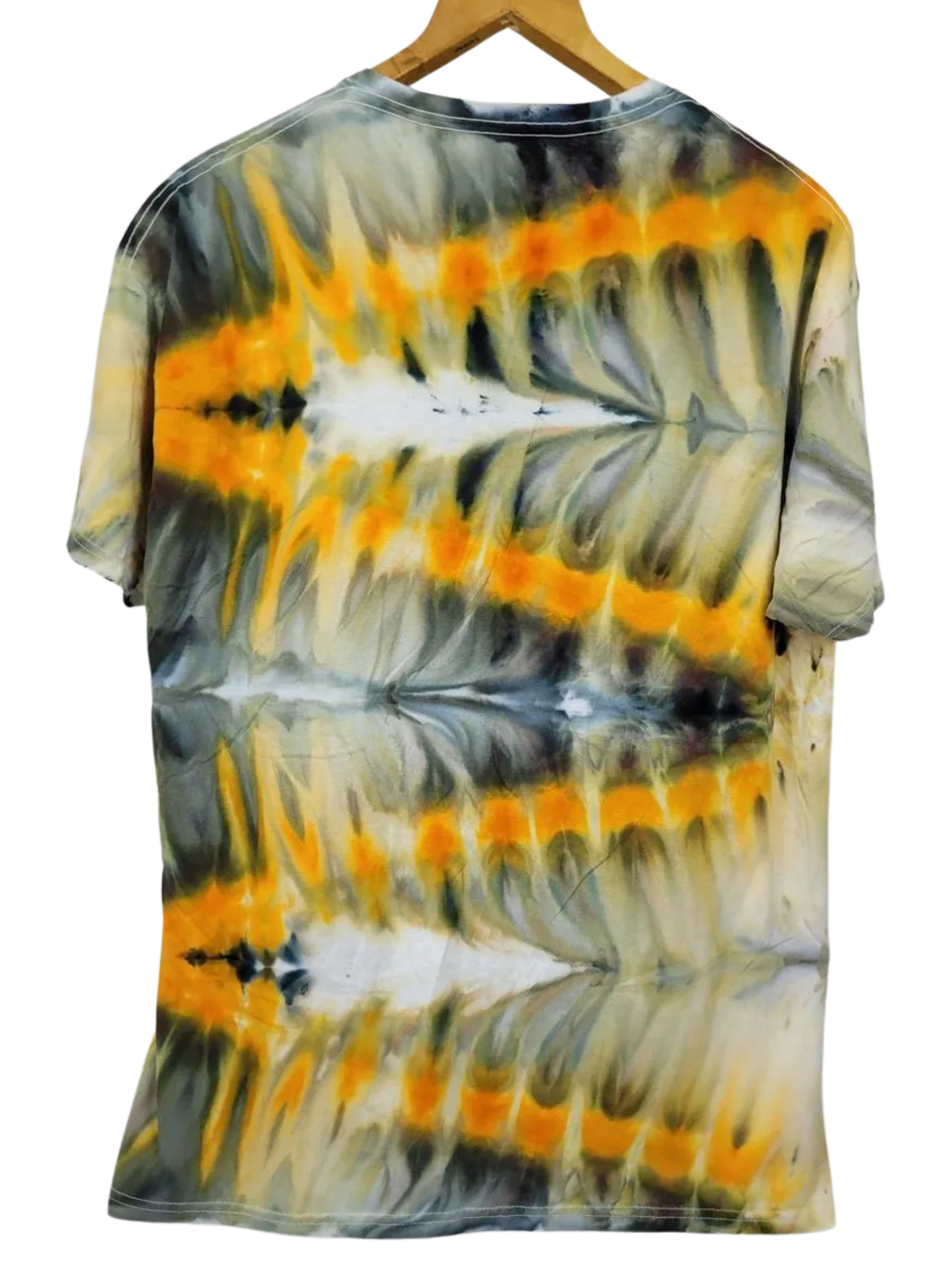 Tie-dye shirt with orange, black, and white pattern on a hanger