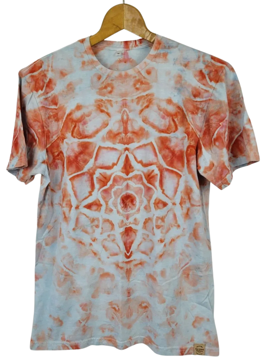 Tie-dye t-shirt with orange and white pattern on a hanger