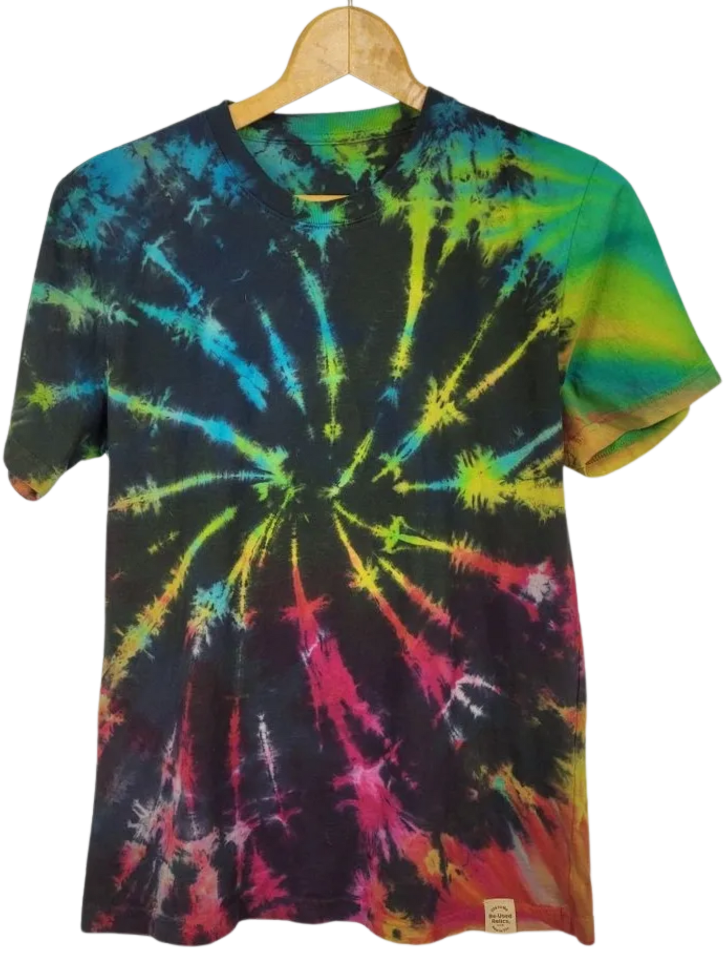 Tie-dye t-shirt with multicolor spiral pattern on a hanger