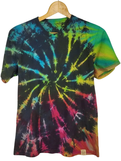 Tie-dye t-shirt with multicolor spiral pattern on a hanger