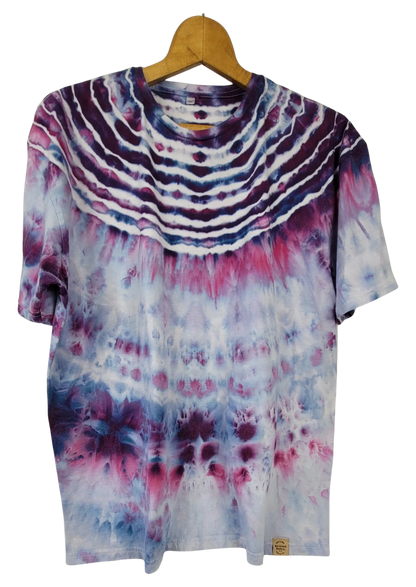 Tie-dye t-shirt on a wooden hanger with a white background