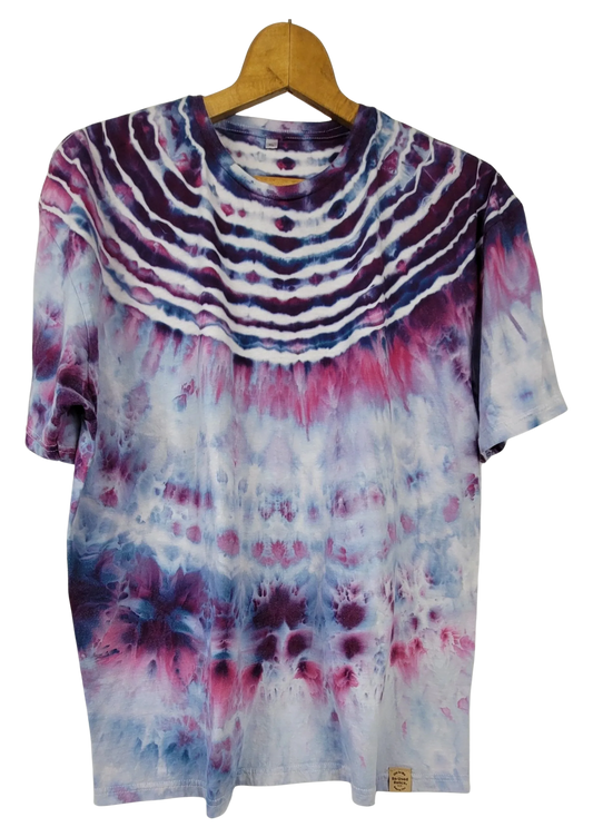 Tie-dye t-shirt on a wooden hanger with a white background