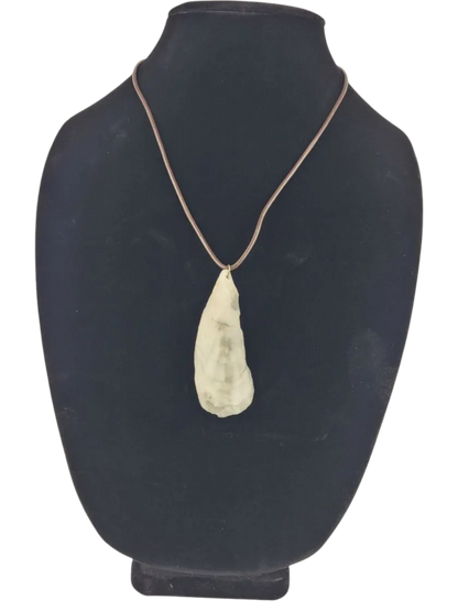 Necklace with a pendant on a black mannequin bust